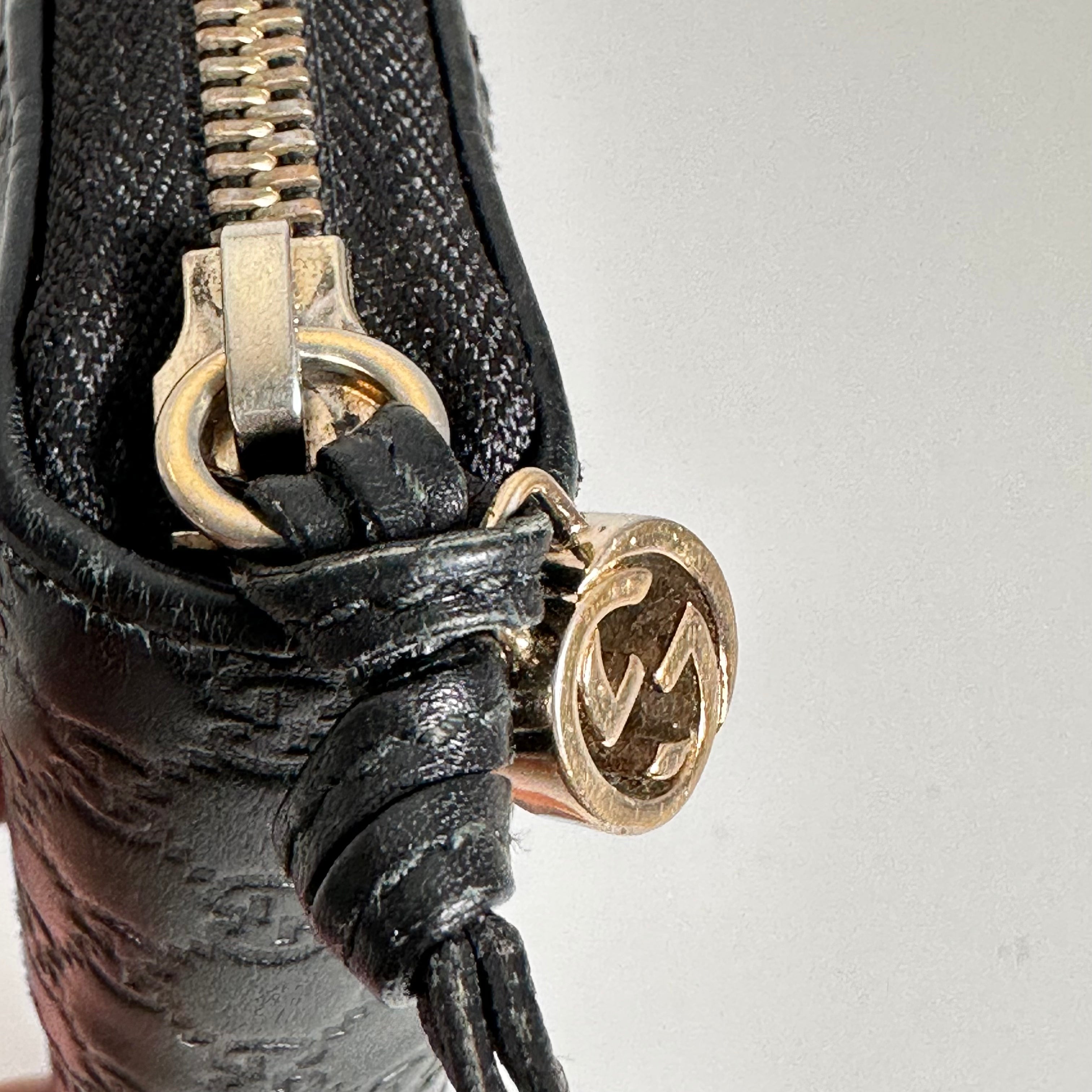 Black Guccissima Zippy Wallet